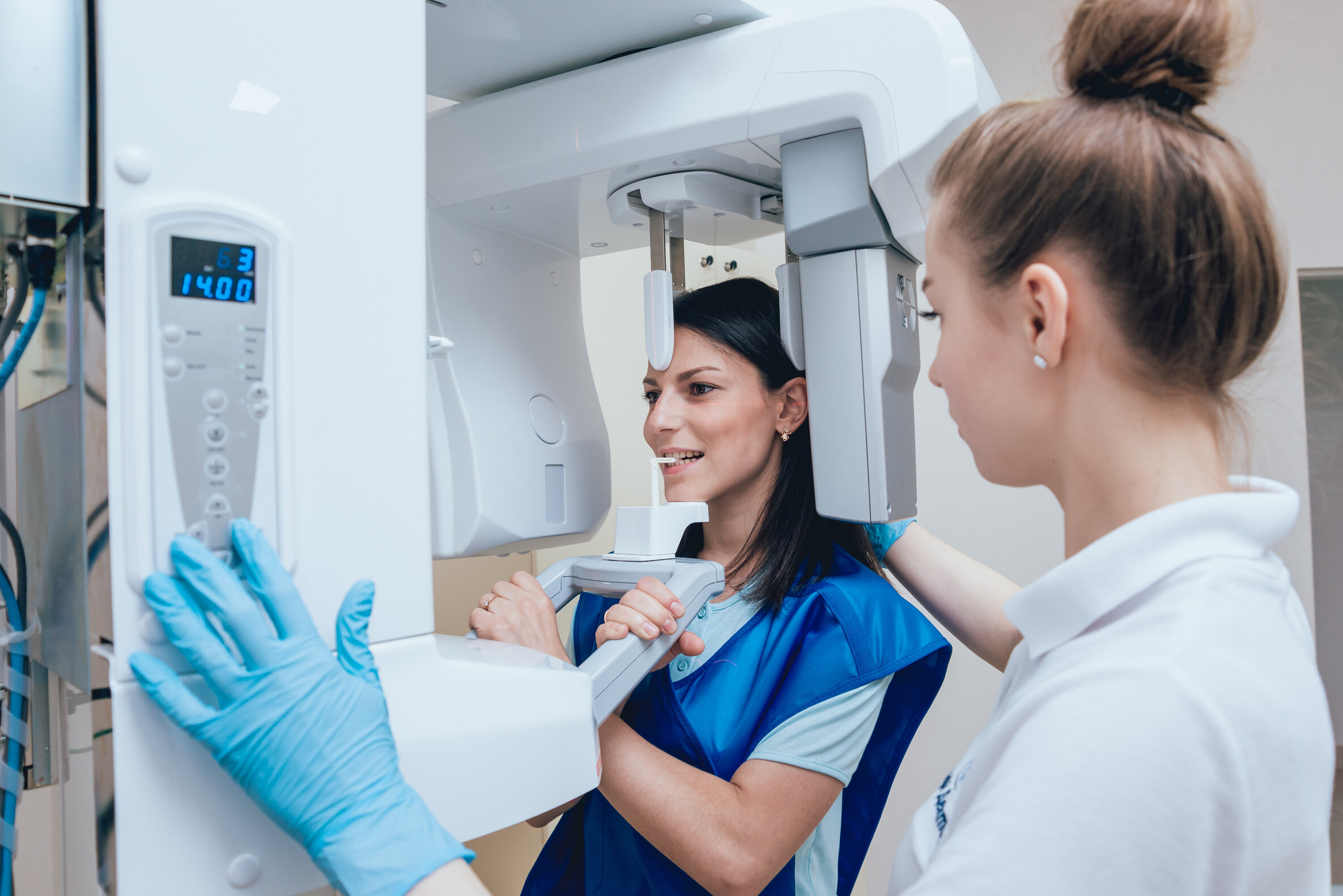 Young,Woman,Patient,Standing,In,X-ray,Machine.,Panoramic,Radiography